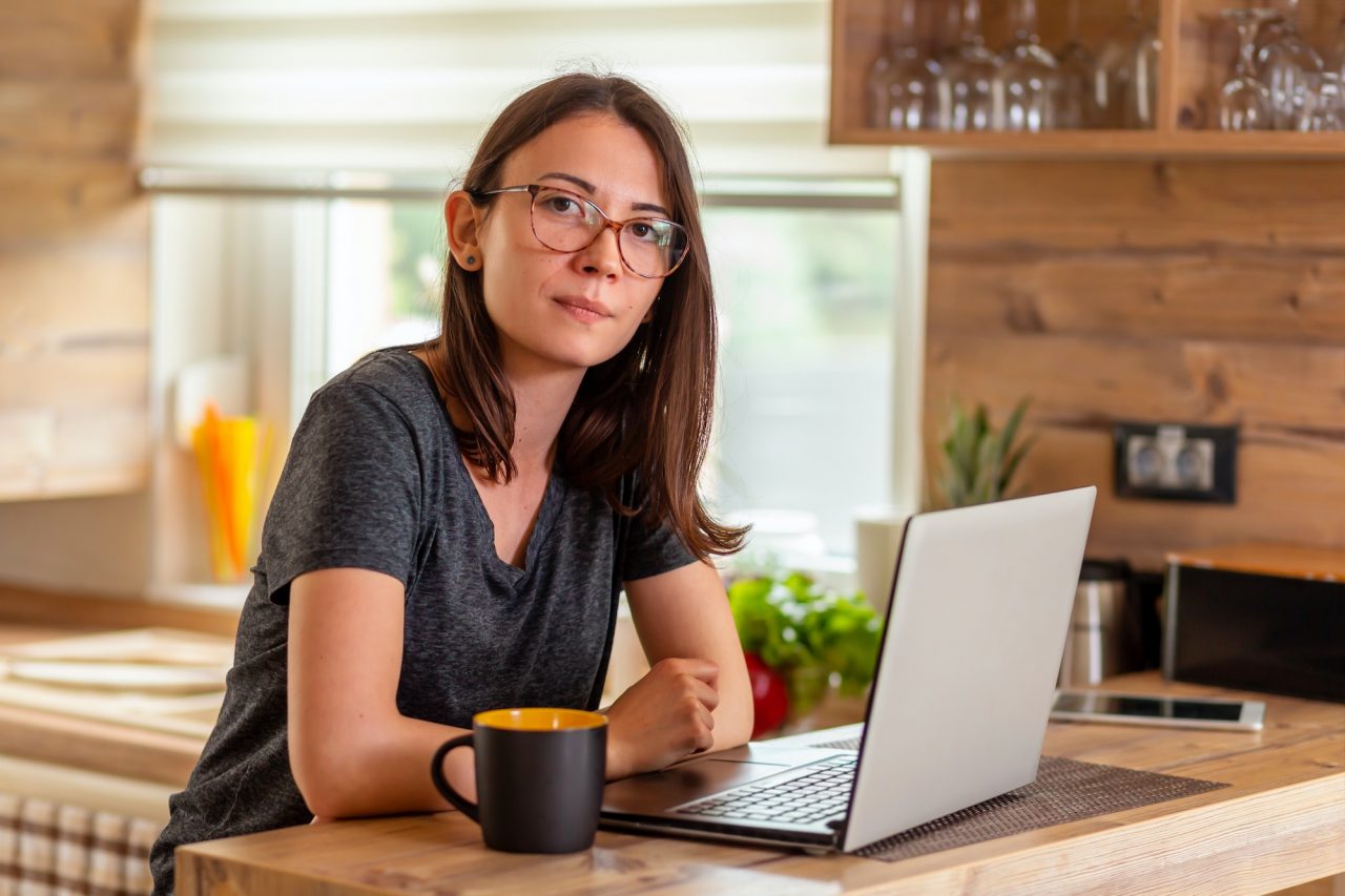 Female web designer working in home office